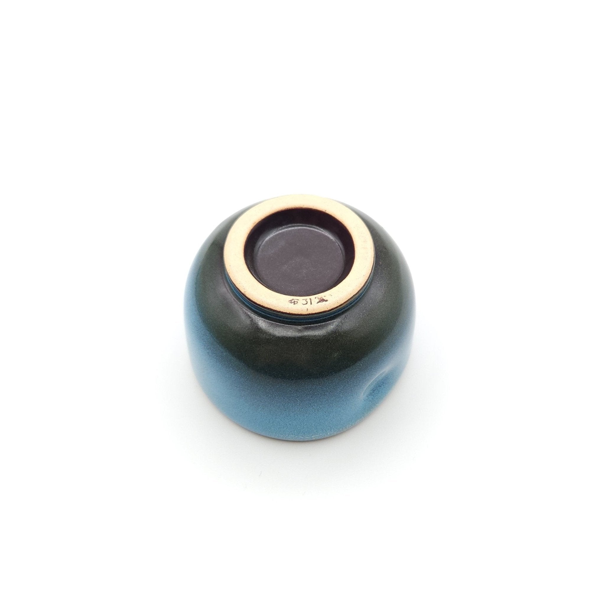 Bottom view of a Japanese blue Teacup made of pottery with an Owl motif.
