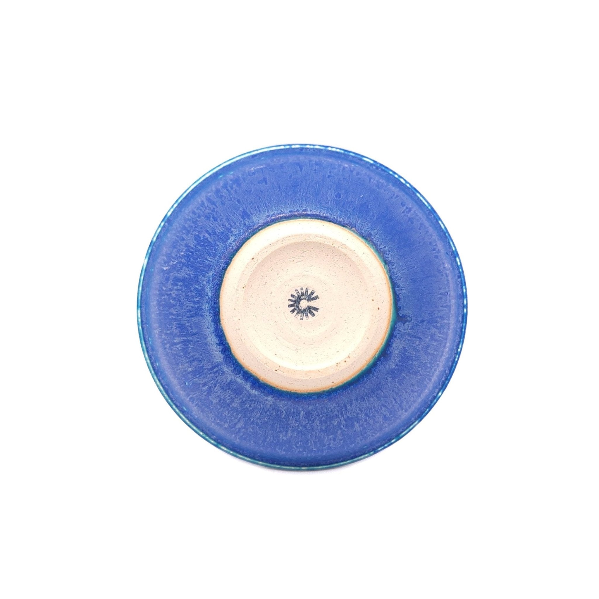 Bottom view of a Japanese pottery bowl, turquoise color