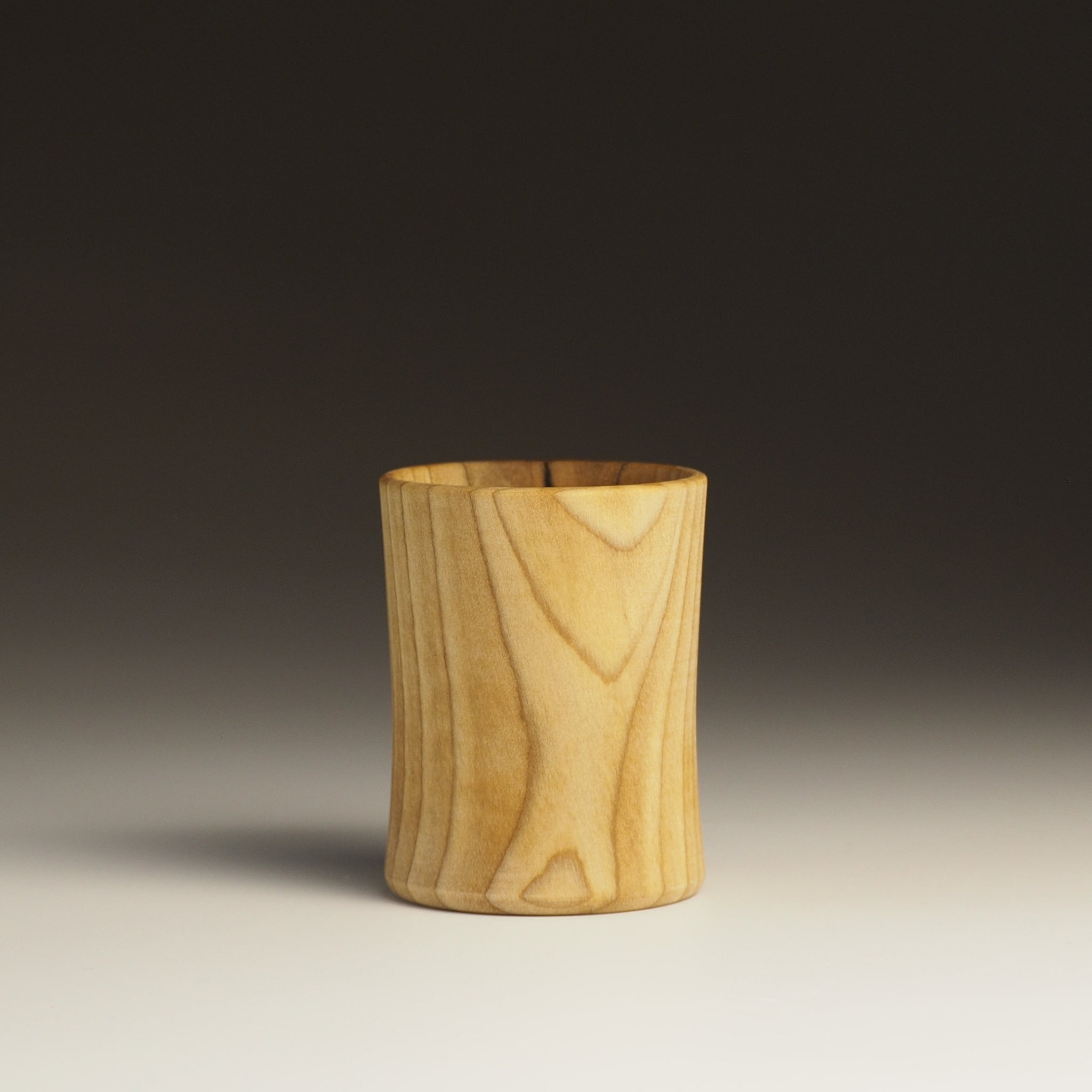 Japanese handcrafted wooden Sake cup gradation background. Tsukushi