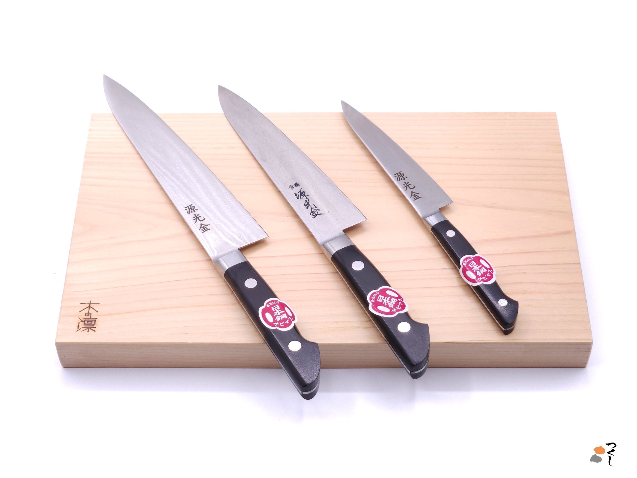 Japanese rectangular Chopping Board with a set of three Japanese knives on top