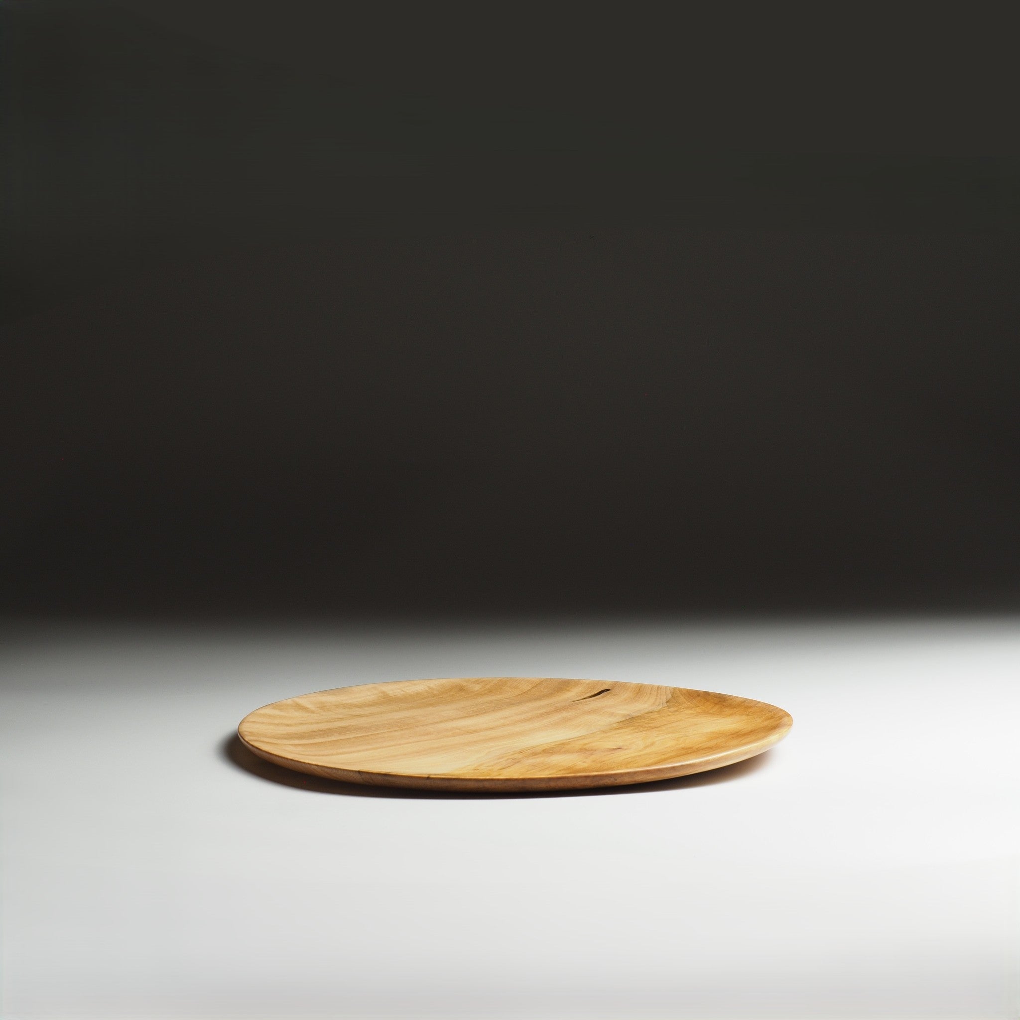 Japanese wood plate on a beige gradation background. Tsukushi