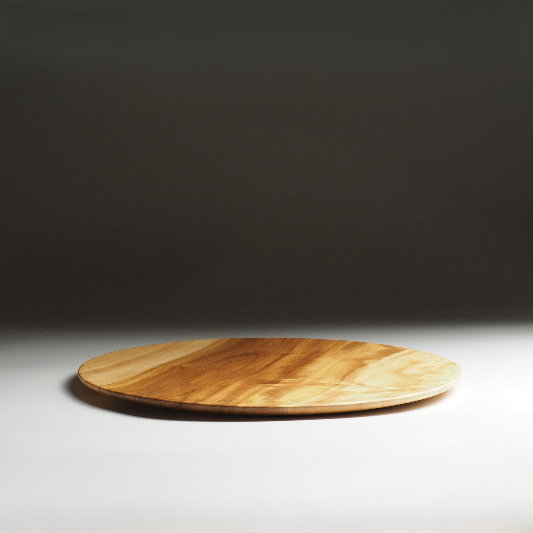 Side view of Japanese wooden dinner plate on a gray gradation background. Tsukushi