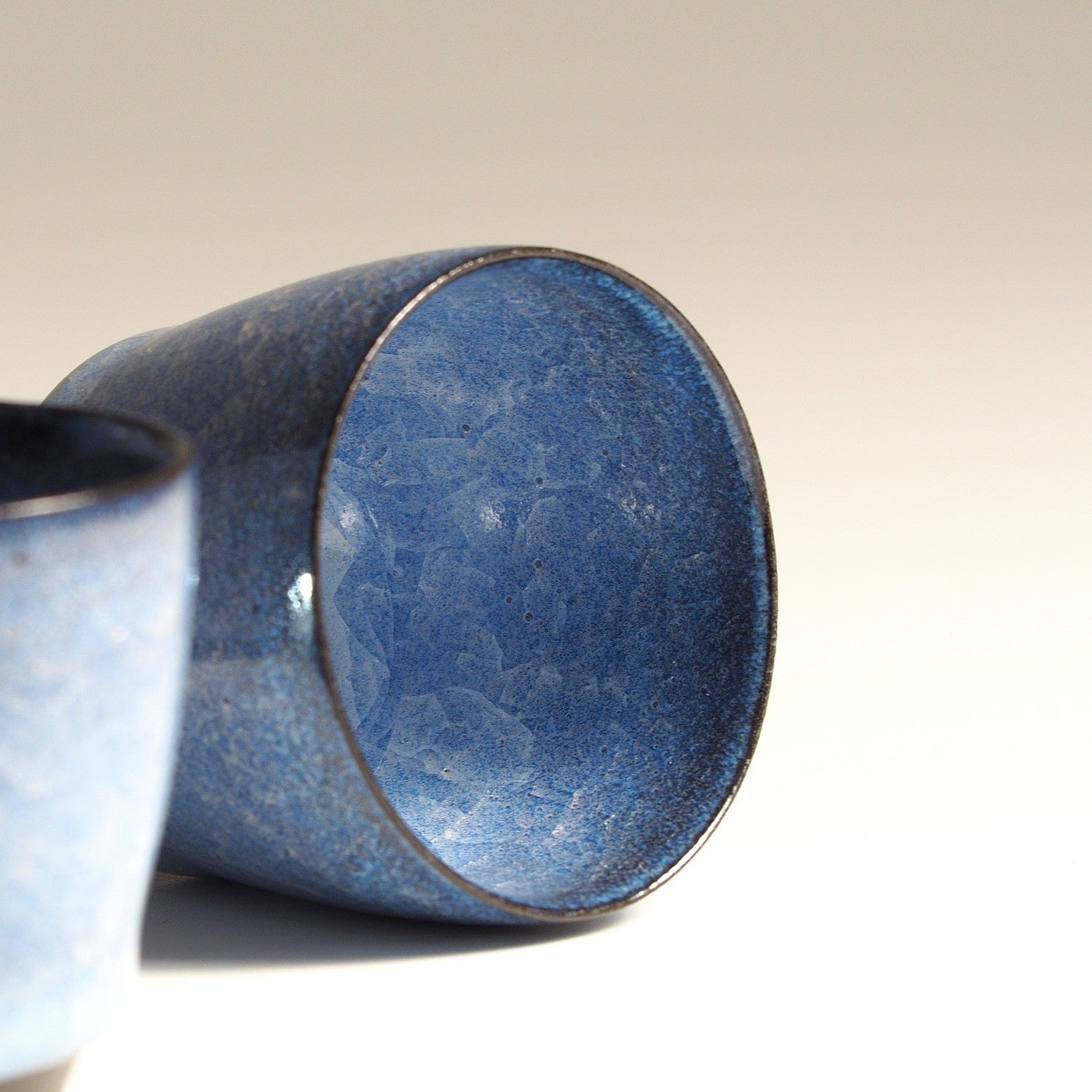 Handmade Japanese pottery crazed design Sake cup beige background zoom, Tsukushi
