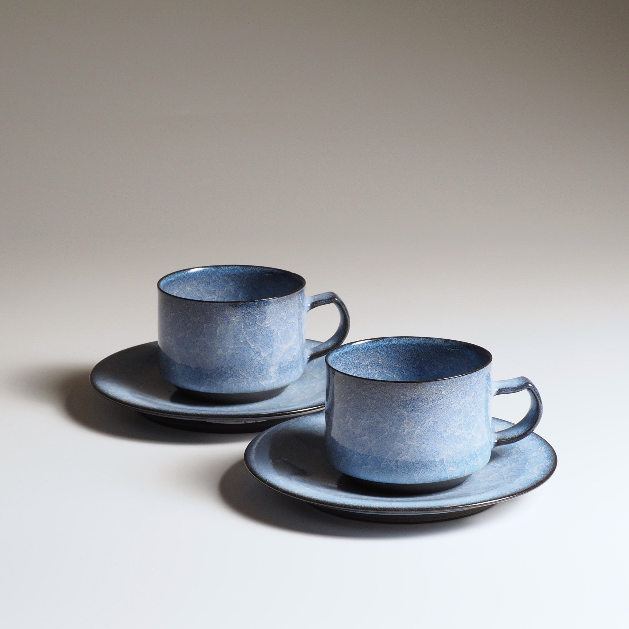 Handcrafted crazing Japanese ceramic coffee cup and saucer background, Tsukushi