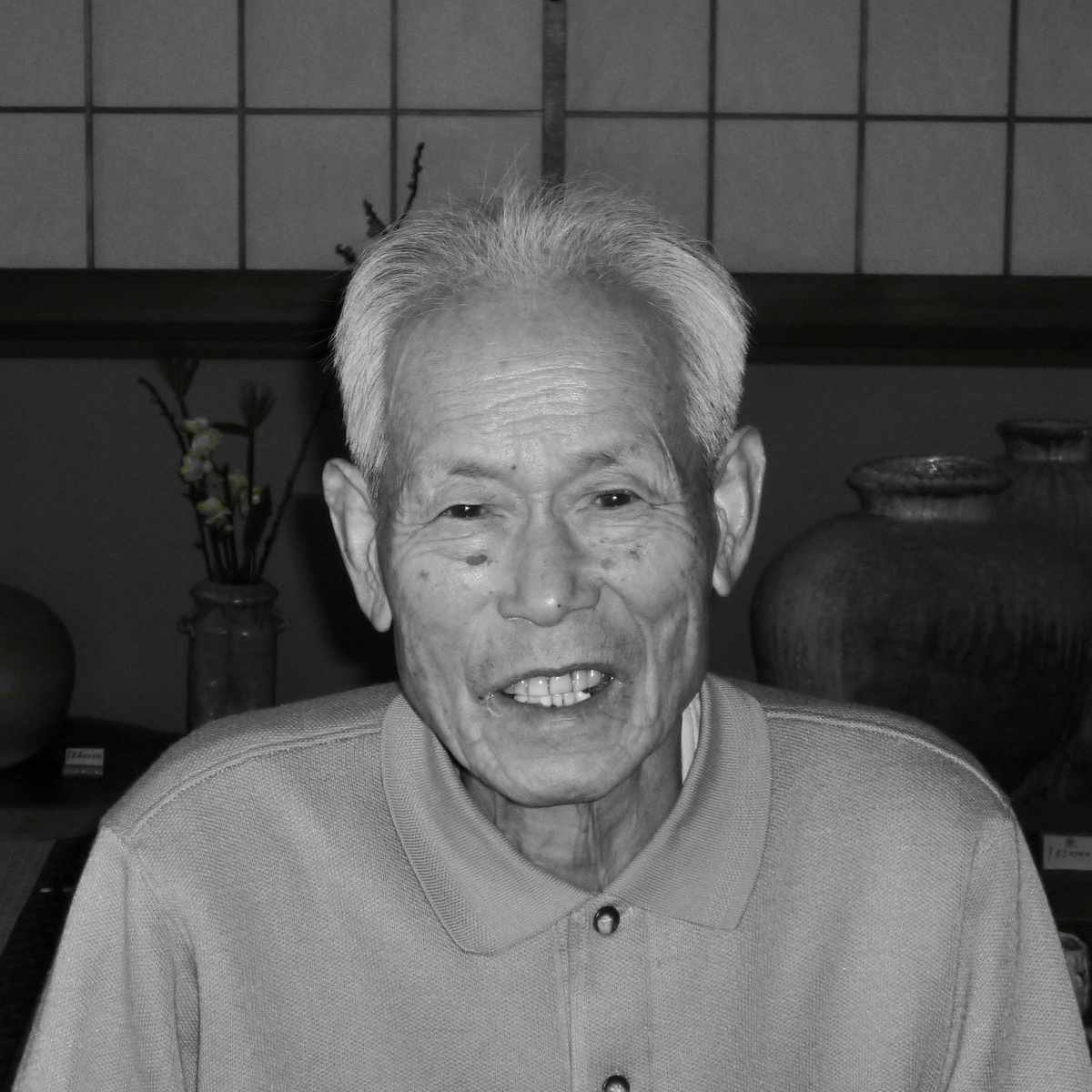 A black and white portrait of Minagawa Takashi, Founder of Tsuchinoko Kiln.