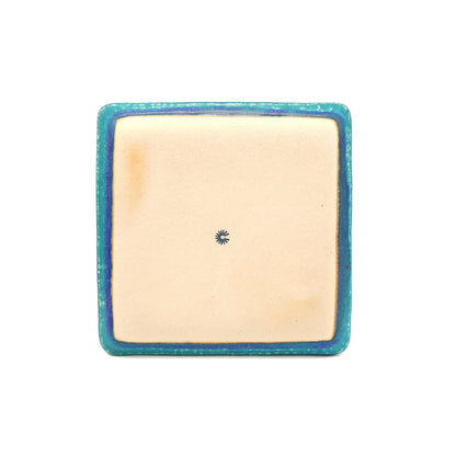 Bottom view of a turquoise Japanese pottery plate measuring 21.5cm (8.5")