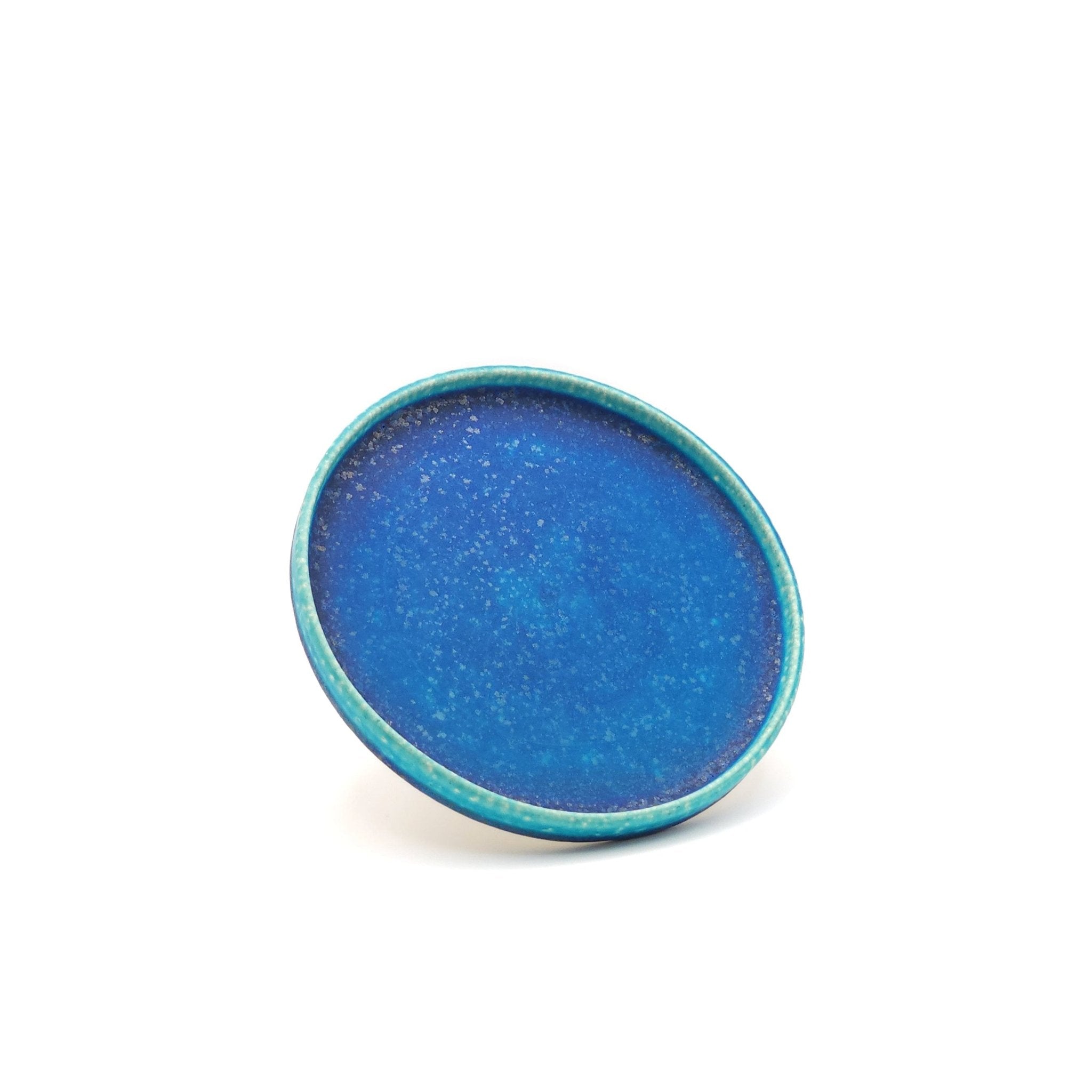 Oblique view of a turquoise Japanese pottery round Plate 16cm (9.4")