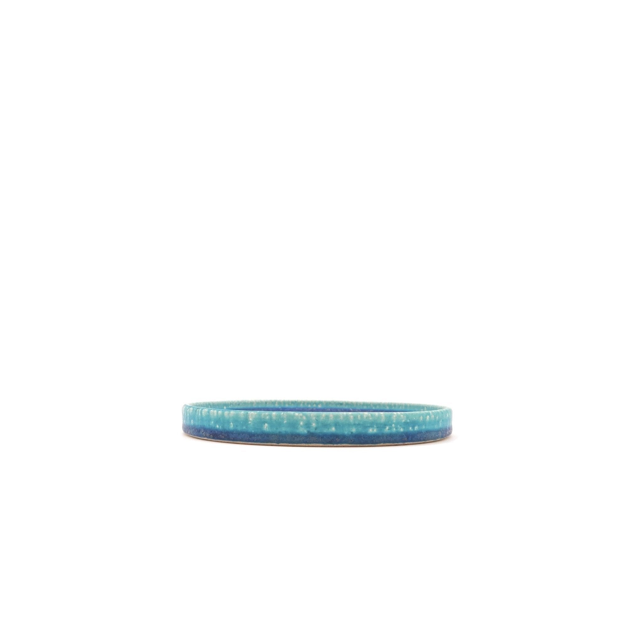 Side view of a turquoise Japanese pottery round Plate 16cm (9.4")