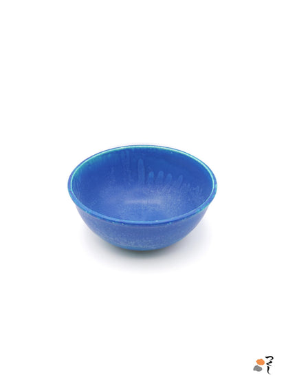 Top front view of a turquoise Japanese pottery serving bowl