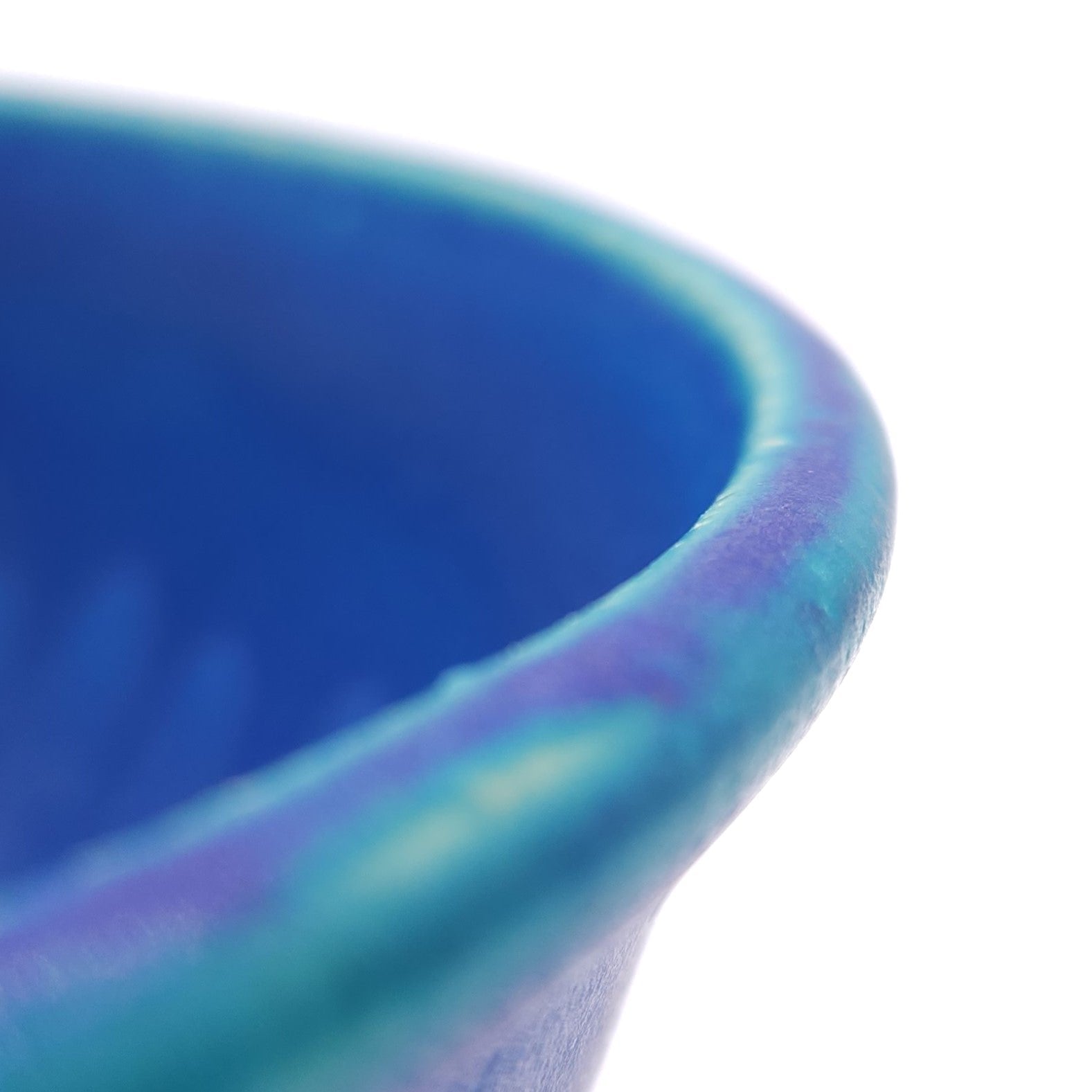 Edge detail of a turquoise Japanese pottery serving bowl