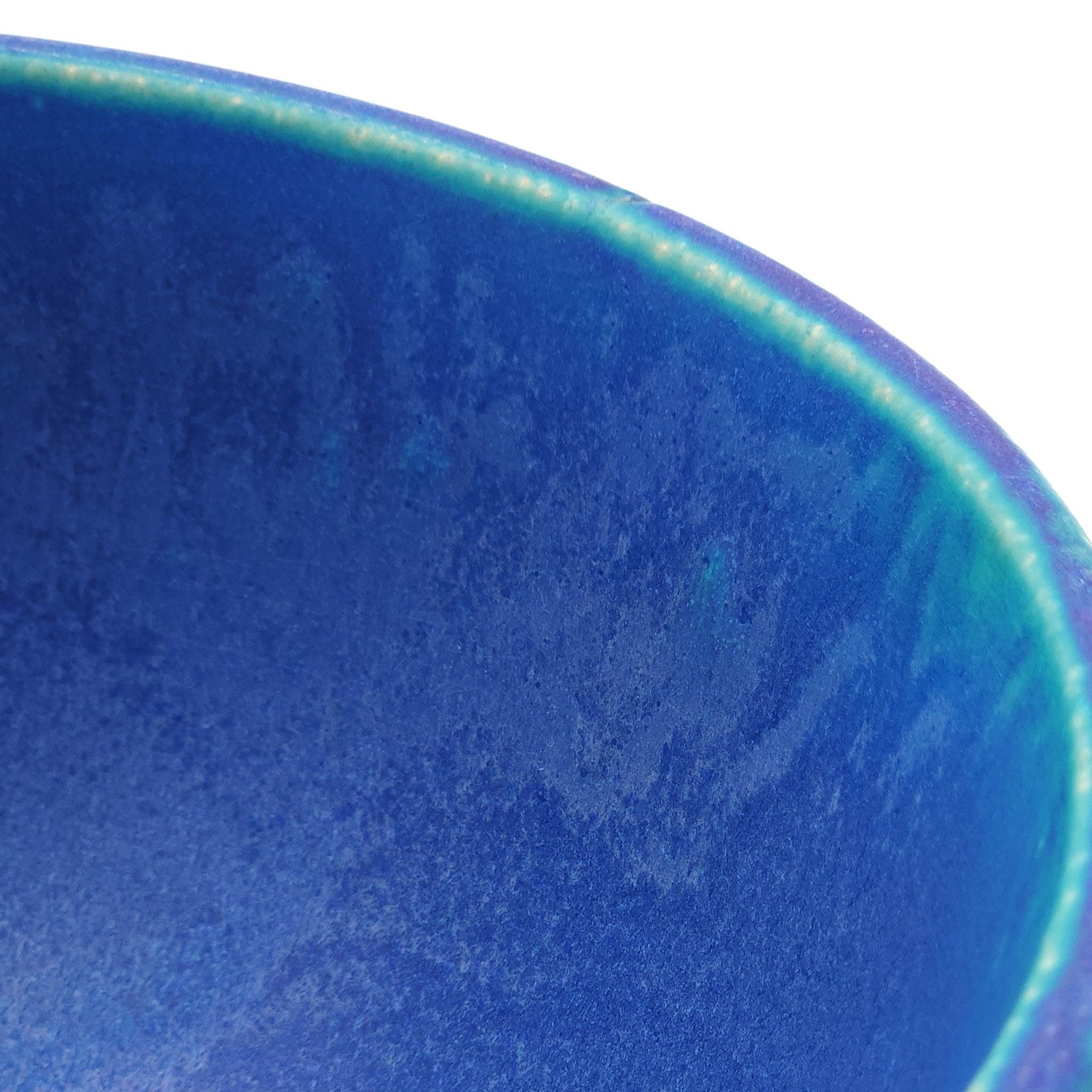 Side detail of a turquoise Japanese pottery serving bowl