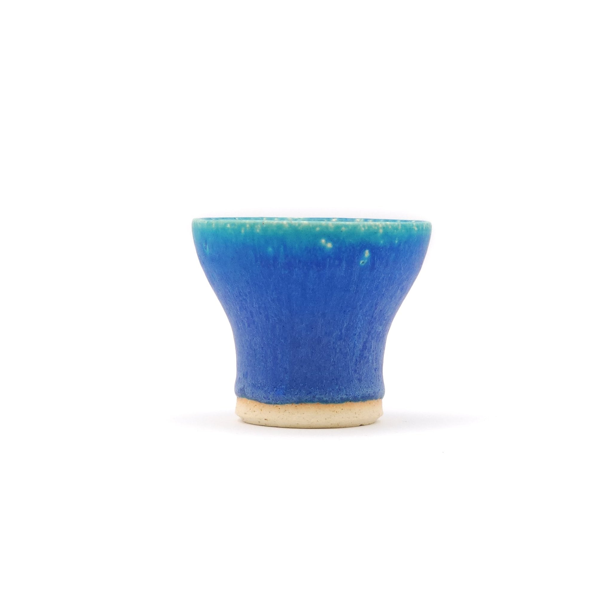 Front side of a turquoise Japanese pottery small cup