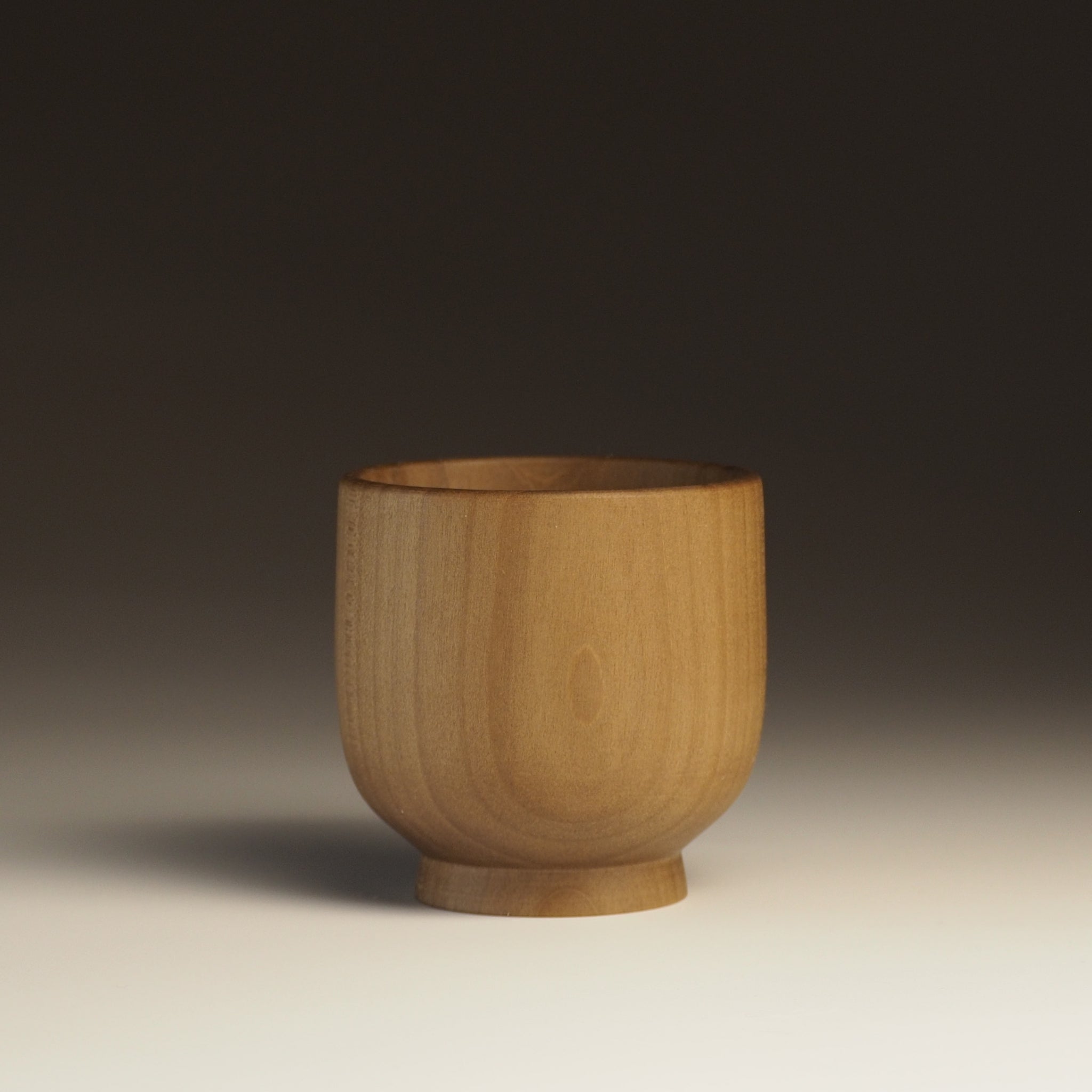 Japanese handcrafted Wooden Teacup on gradation background. Tsukushi