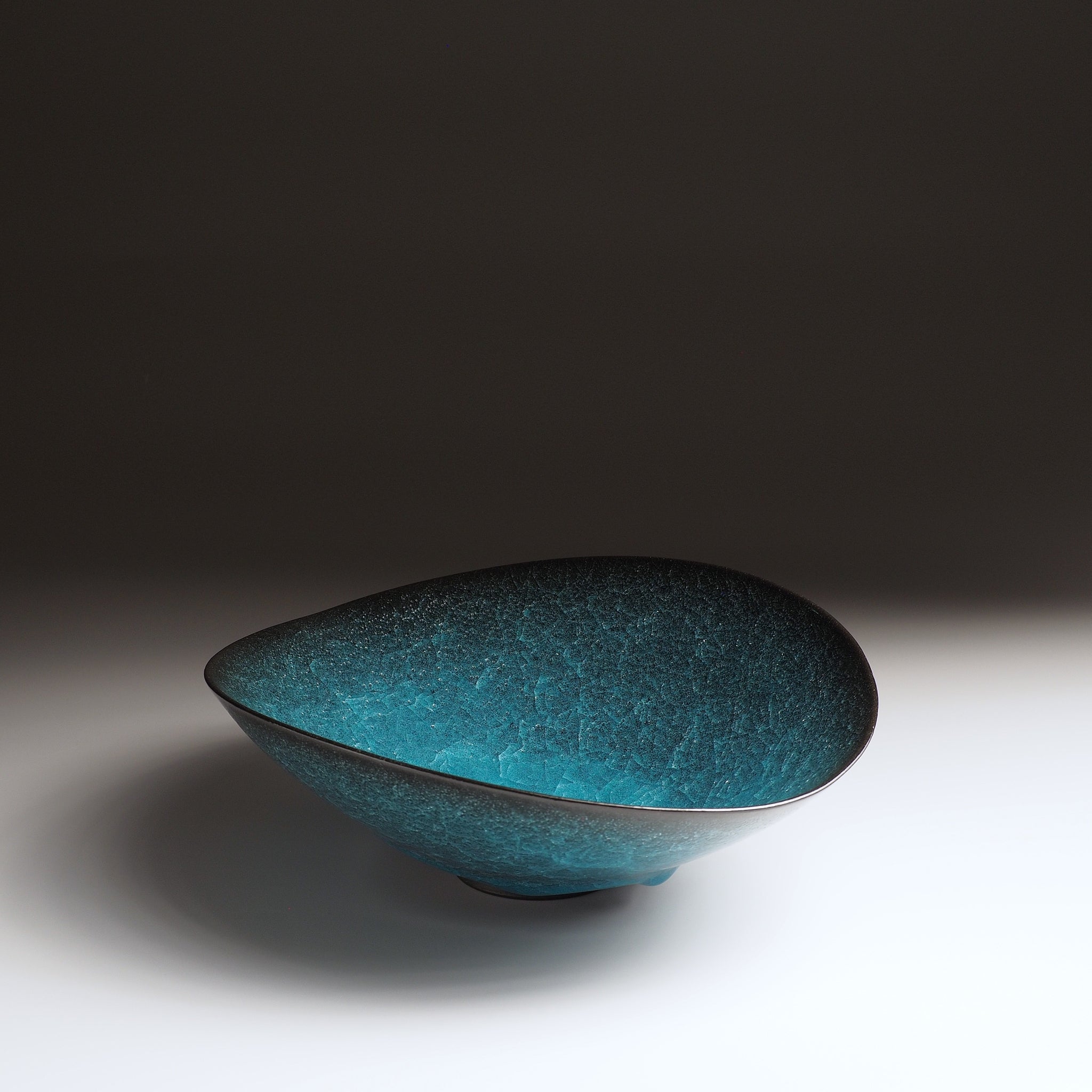 Aonami waved serving bowl, three-quarter view showing interior teal kannyu craquelé glaze. Taichi Kawai, Usurai Pottery, Japan.
