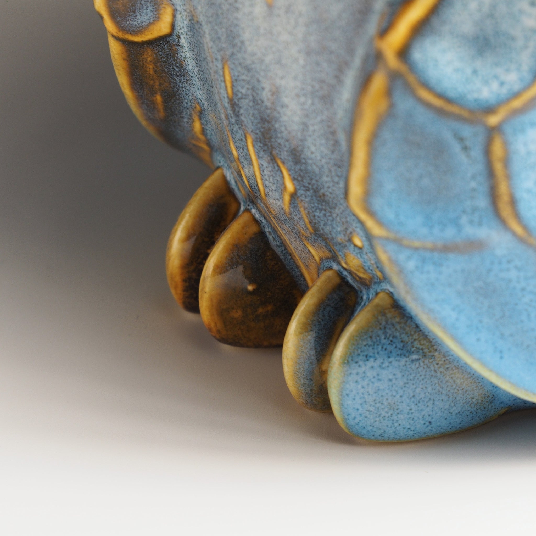 Claws detail of the large Fukumori owl figurine by Kazuhiro Kojima, handcrafted in Japan, cerulean blue glazed ceramic feet, Tsukushi.