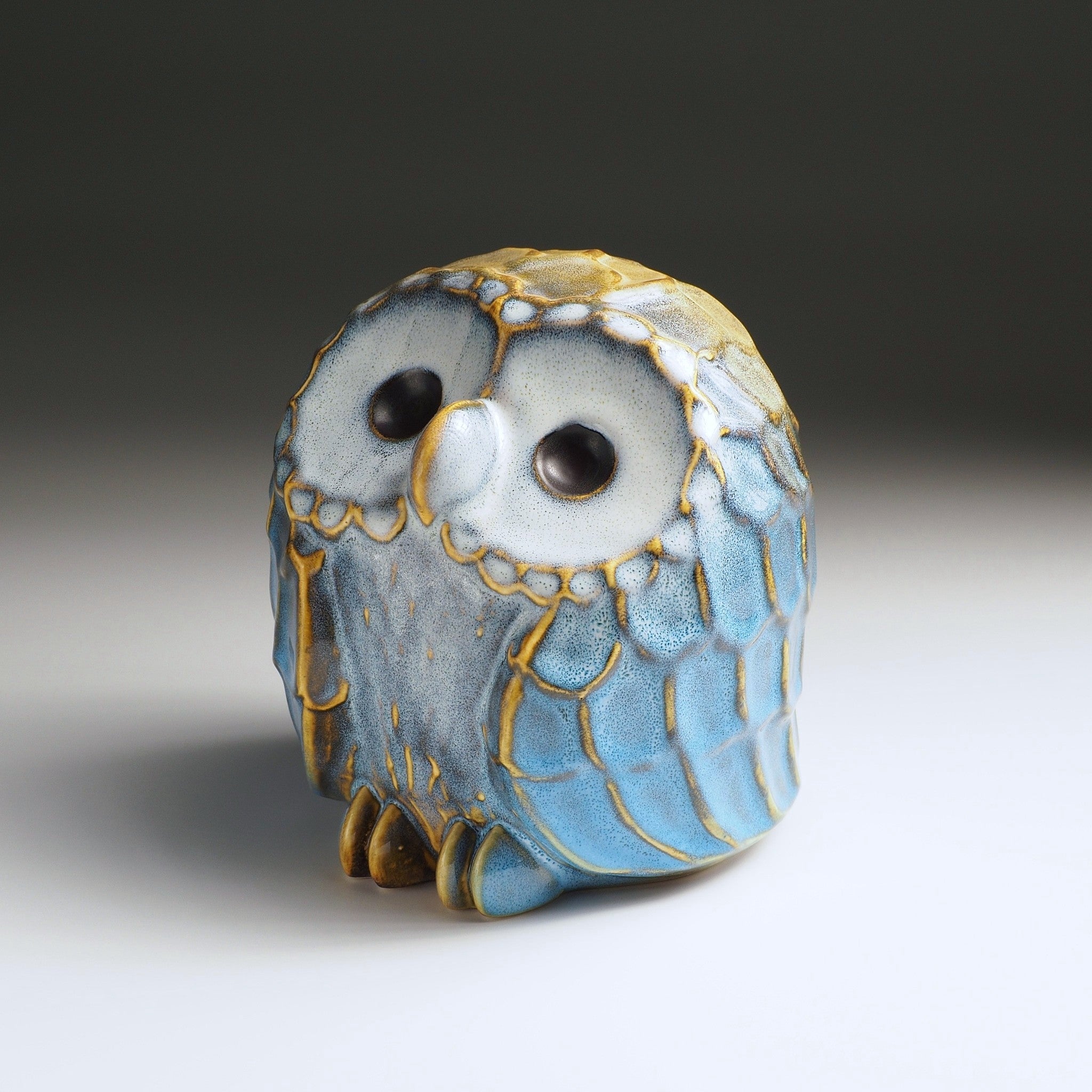 Large Fukumori owl-shaped ceramic ornament ny K. Kojima with gold and blue glaze accents, three-quarter front view
