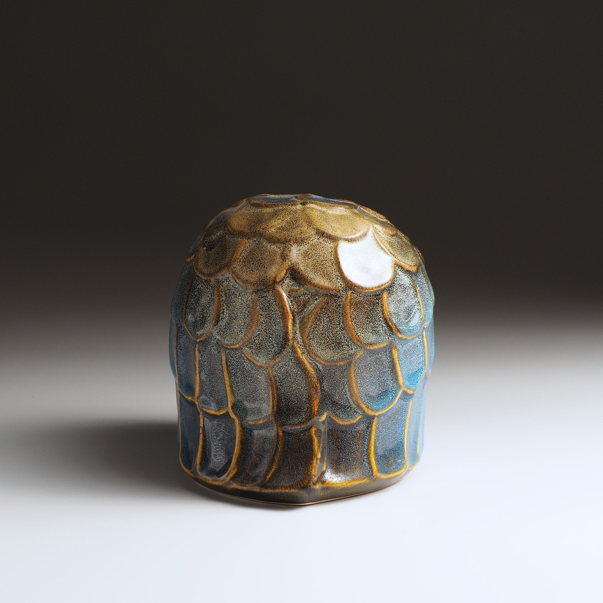 Back view of the Fukumori medium ceramic owl figurine by Kazuhiro Kojima, cerulean blue Nanasai Tenmoku glaze, handcrafted in Japan.