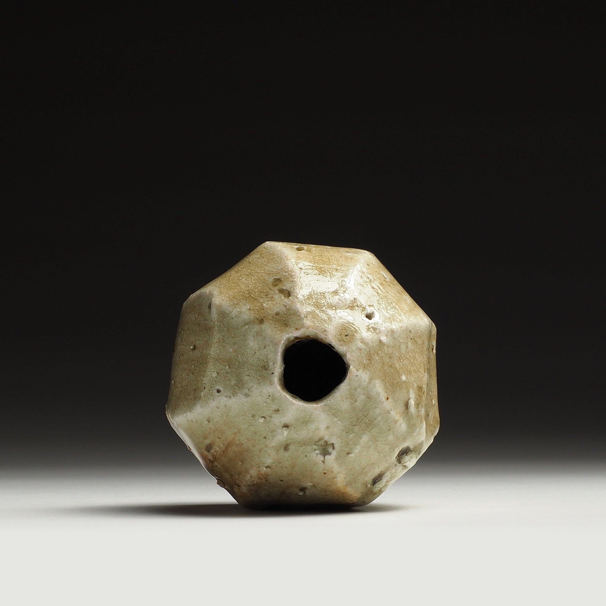 Top view of the Kokeishi handmade Shigaraki flower vase showing its small circular opening and faceted rim.