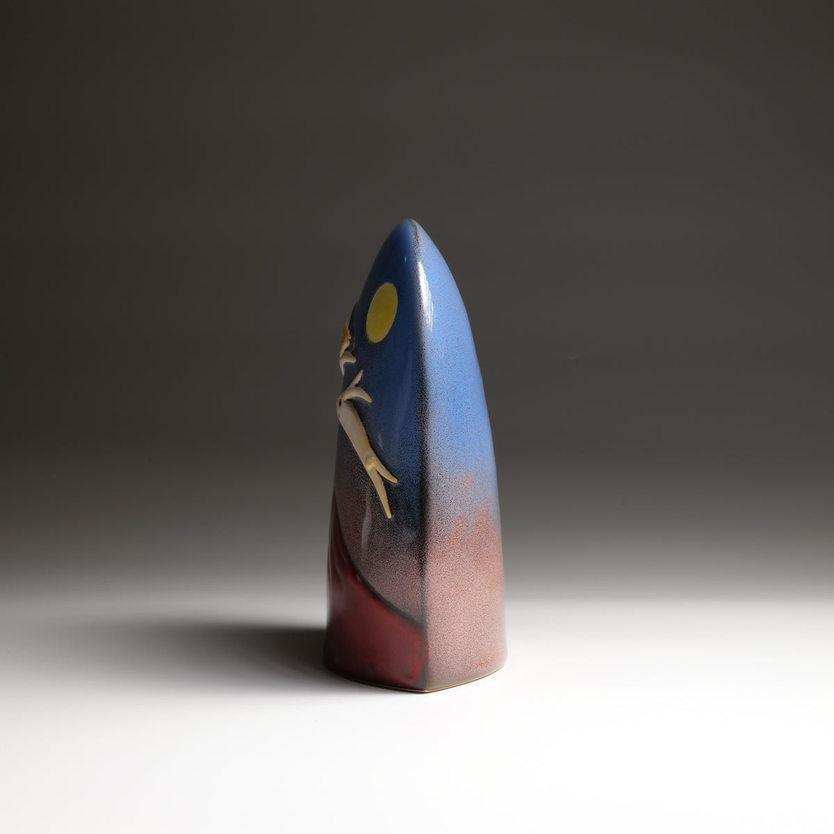 Tsukimi ceramic ornament by Kazuhiro Kojima, side view highlighting its curved ceramic form.