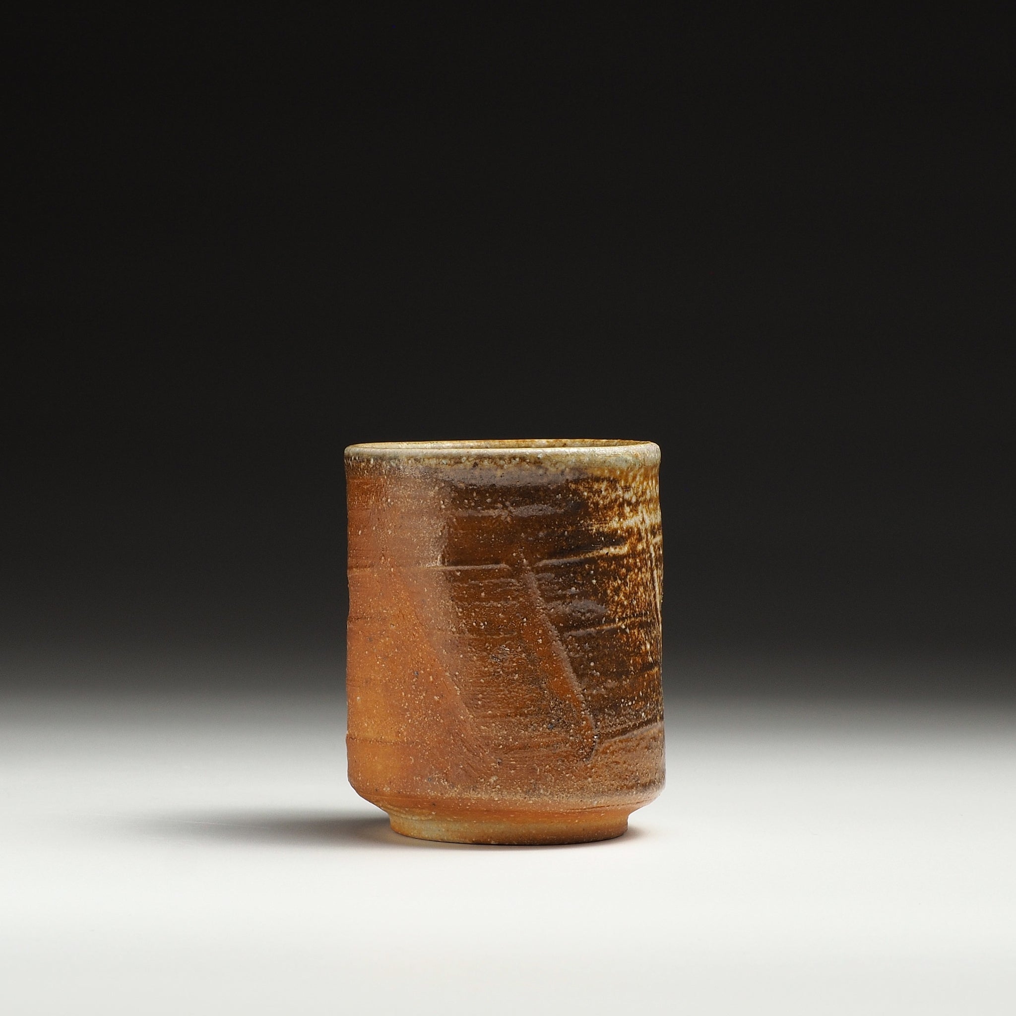 Single Yubae Shigaraki yunomi showing a warm brown body with pale ash-fired markings.